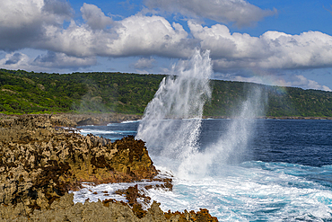 Huge blowhole on the rugged coast of Christmas Island, Australia, Indian Ocean