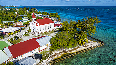 Aerial of the Catholic church in Avatoru, Rangiroa atoll, Tuamotus, French Polynesia, South Pacific, Pacific