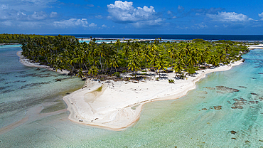 Aerial of little island with white sand beach, the Ile aux Recifs, Rangiroa atoll, Tuamotus, French Polynesia, South Pacific, Pacific