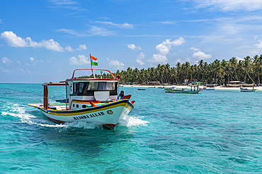 Little boats before a palm fringed white sand beach, Agatti Island, Lakshadweep archipelago, Union territory of India, Indian Ocean, Asia