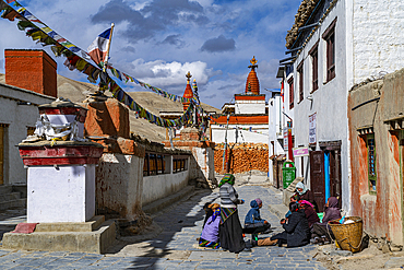 Local women practising traditional weaving in Lo-Manthang village, Kingdom of Mustang, Nepal, Asia