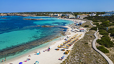 Aerial of the turquoise waters and white sand beach of the Pujols beach, Formentera, Balearic Islands, Spain, Mediterranean, Europe