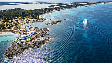 Aerial of the turquoise waters and white sand beach of the Pujols beach, Formentera, Balearic Islands, Spain, Mediterranean, Europe