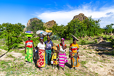 Kapsiki women coming back from the fields, Rhumsiki, Mandara mountains, Far North province, Cameroon, Africa