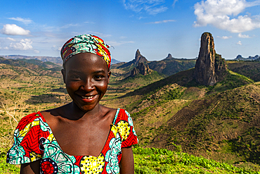 Kapsiki tribal girl in front of the lunar landscape of Rhumsiki , Rhumsiki, Mandara mountains, Far North province, Cameroon, Africa