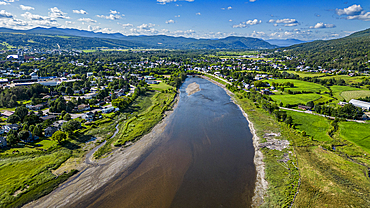 Aerial of the Gouffre River flowing in the St. Lawrence River, Quebec, Canada, North America