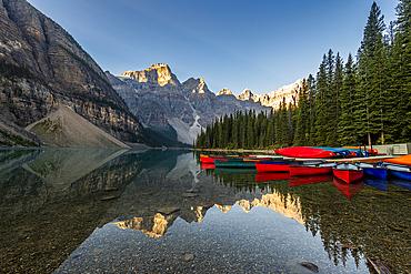 Canoes at sunrise at Lake Moraine, Banff National Park, UNESCO World Heritage Site, Alberta, Rocky Mountains, Canada, North America