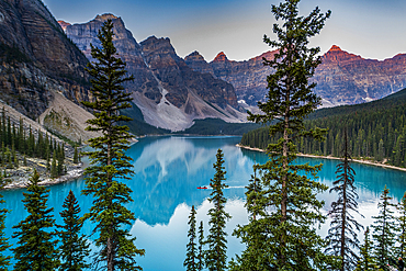 Kayaker at sunrise at Lake Moraine, Banff National Park, UNESCO World Heritage Site, Alberta, Rocky Mountains, Canada, North America