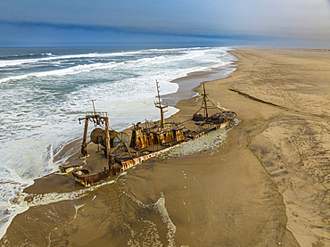 Aerial of a shipwreck on a beach in the Iona National Park, Namibe, Angola, Africa