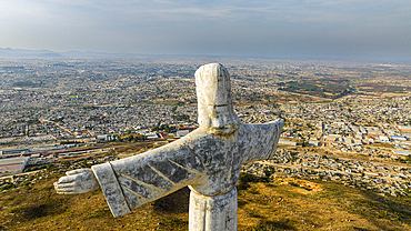 Aerial of the Christ the King Statue, overlooking Lubango, Angola, Africa