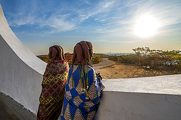 Muila girls standing in the Christ the King Statue, overlooking Lubango, Angola, Africa