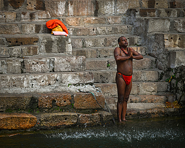 Man praying before bathing, Kamakhya Temple, Guwahati, Assam, India, Asia