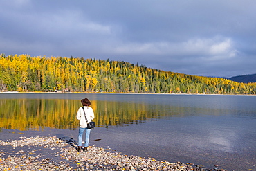 Woman on the shore of Lake McDonald, Glacier National Park, Montana, United States of America, North America