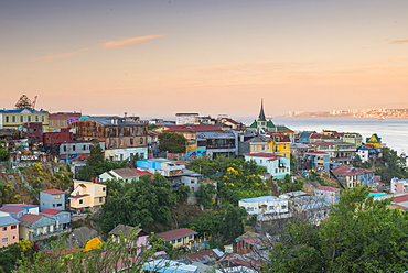 Sunset over the colourful buildings of Valparaiso, Chile, South America