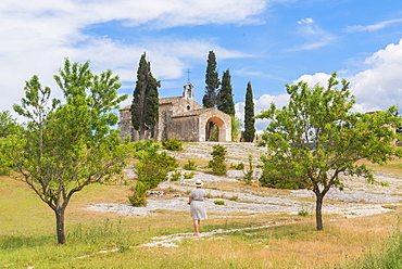 Woman in front of church, St. Remy de Provence, Provence, France, Europe