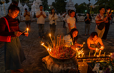 Local people celebrating the Magha Puja full moon festival at the Wat Suan Dok Lanna temple, Chiang Mai, Thailand, Southeast Asia, Asia