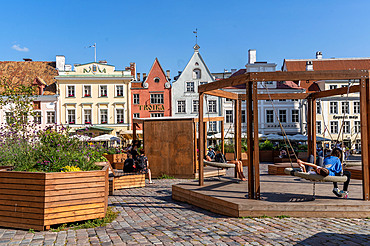 Views of old historical and traditional buildings and visitors to the Old Town, UNESCO World Heritage Site, in central Tallinn, Estonia, Europe