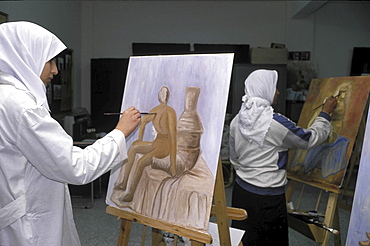 Art class, palestine. Gaza. Young women painting at an art class