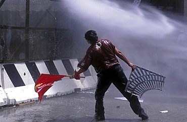 Protest, italy. Demonstrators soaked by polices water cannon during the g8 summit in genoa