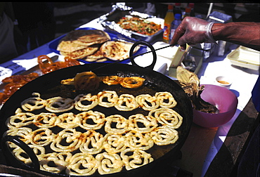 Street kitchen, bangladesh. Dhaka. Food stall selling fried phokaras