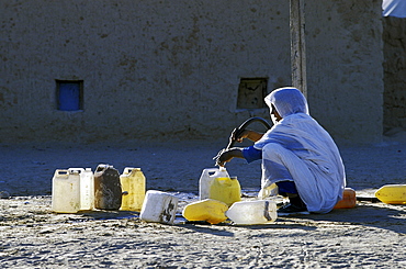 Refugee camp, algeria. Woman fetching water at the polisario smara camp