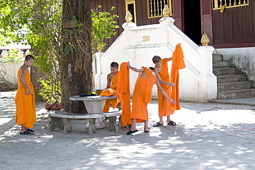 Laos, monks at a monastery in the holy city of luang prabang