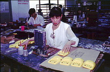 China, working with solvents without protection at toy factory, guangdong province.