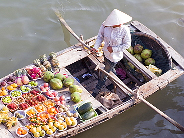 Vietnam, woman selling fruits in halong bay