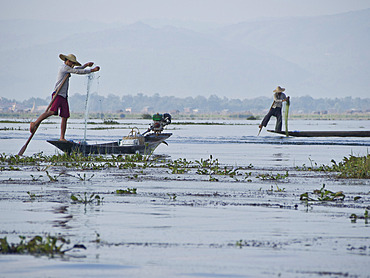 Fishermen cast their nets in Inle Lake, Shan State, Myanmar (Burma), Asia