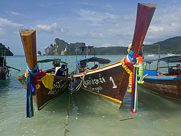 Tourists on long-tail boat in the Phi Phi islands, Andaman Sea, Thailand, Southeast Asia, Asia