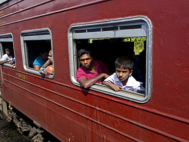 Passengers in the train journey from Kandy to Ella, in the highlands of Sri Lanka, Asia