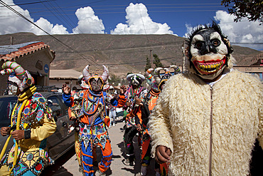 Revellers in costumes and masks at Humahuaca carnival in Jujuy province in the Andes region of Argentina, South America