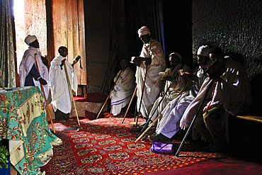 Priests singing during Easter Orthodox Christian religious celebrations in the ancient rock-hewn churches of Lalibela, Ethiopia, Africa