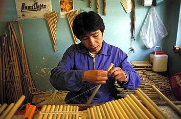 Musical instrument workshop, bolivia. La paz. The man is making traditional pan pipes