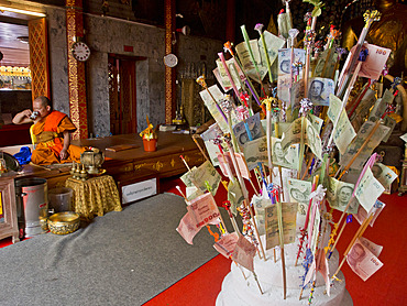 Monk and money gifts in the Wat Phra That Doi Suthep Buddhist temple in Chiang Mai, Thailand, Southeast Asia, Asia