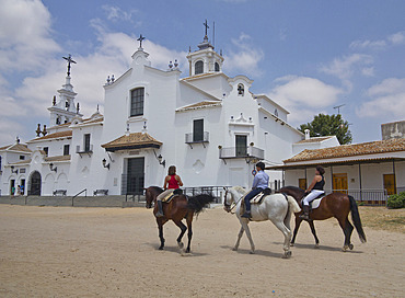 Horse-riding in the village of El Rocio, centre of religious pilgrimage in Andalucia, Spain, Europe