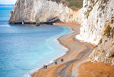 Tourists on Durdle Door beach on the Jurassic Coast, UNESCO World Heritage Site, Dorset, England, United Kingdom, Europe