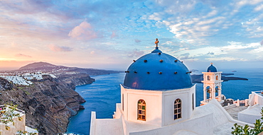 Sunrise shot of the Church in Imerovigli, looking over to Fira and the Caldera of Santorini, Santorini, Cyclades, Aegean Islands, Greek Islands, Greece, Europe