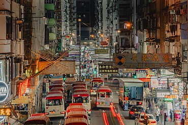 Hong Kong Minibuses lining up next to the Night Markets of Mong Kok, in Hong Kong