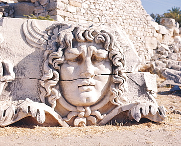 Carved head of Medusa at the archaeological site of Didyma , Turkey 