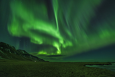 Aurora borealis (Northern Lights) and partially frozen lake, North Snaefellsnes, Iceland, Polar Regions