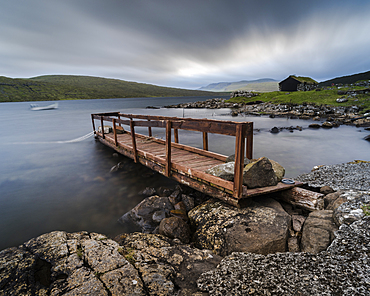 Wooden pier and boathouse on Lake Letisvatn, Vagar Island, Faroe Islands, Denmark, Atlantic, Europe