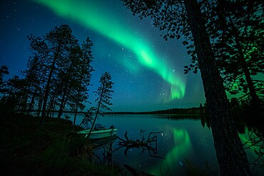 Aurora borealis (Northern Lights) reflected in Lake Pallas, Muonio, Lapland, Finland, Europe