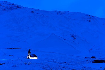 Vik Church illuminated at dawn, Vik, Iceland, Polar Regions