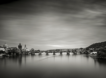 Pleasure cruiser moving beneath Charles Bridge, Prague, Czechia (Czech Republic), Europe