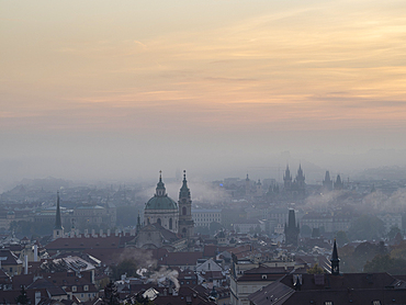 View of Prague spires and towers in morning mist from Petrin Hill, Prague, Czechia (Czech Republic), Europe