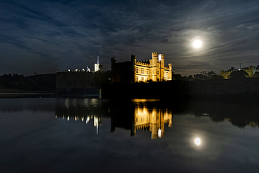 Full moon rising over Leeds Castle, near Maidstone, Kent, England, United Kingdom, Europe