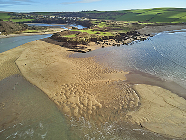 A low tide aerial drone view of the sandy shore and sand banks in the estuary of the River Avon, at Bantham, on the south coast of Devon, Great Britain.