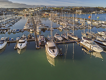 An aerial drone view of boats moored in the marina at Brixham, in Torbay, Devon, Great Britain.