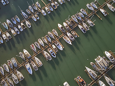 An aerial drone view of boats moored in the marina at Brixham, in Torbay, Devon, Great Britain.